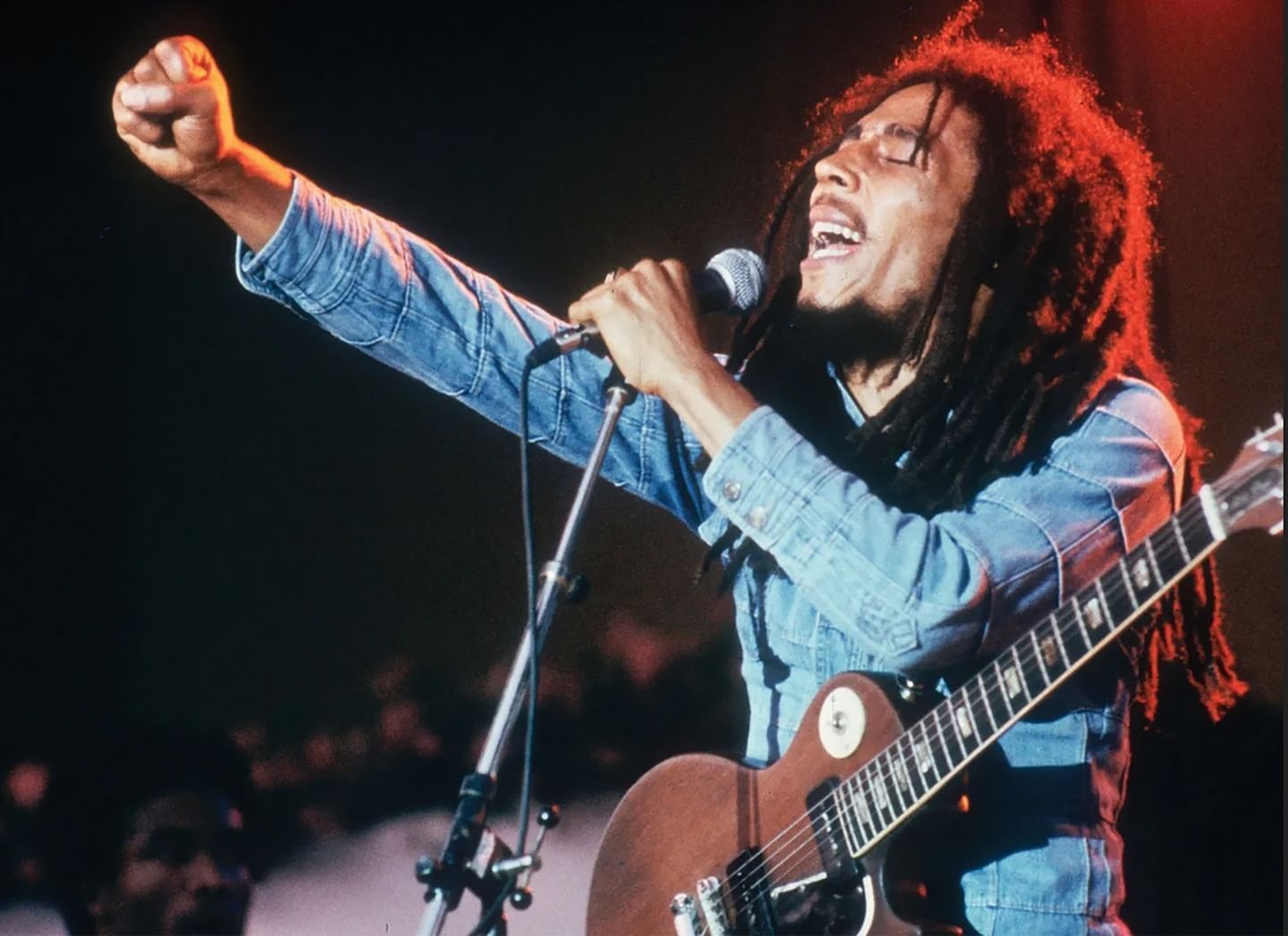 Bob Marley performing on stage with his signature at Jamaica Pegasus Hotel