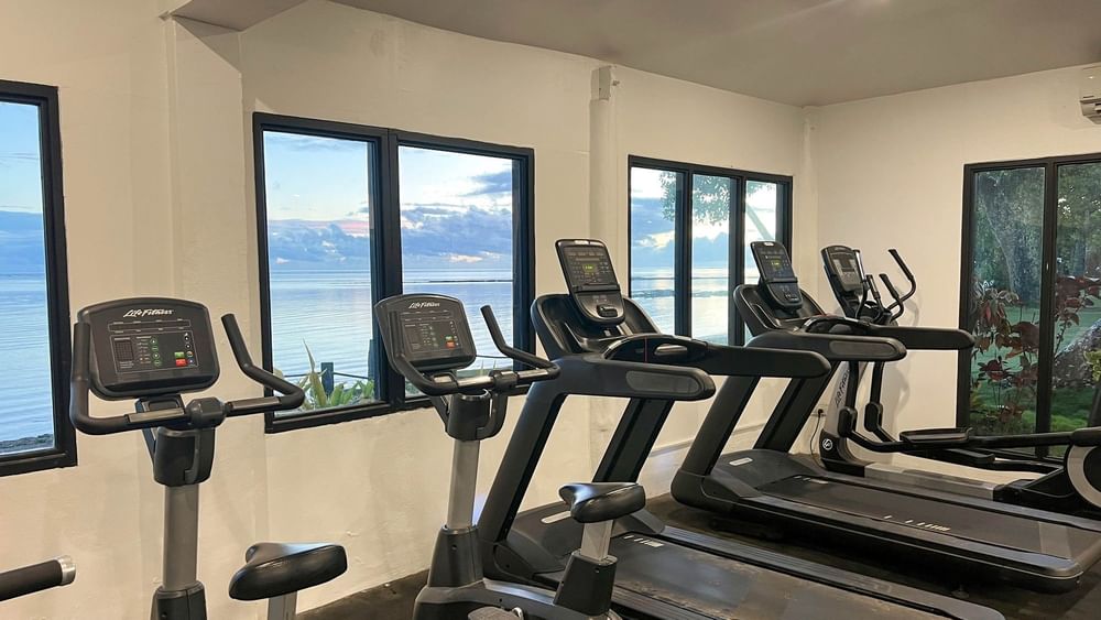 Row of treadmills with ocean view at The Naviti Resort in Korolevu.