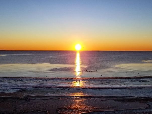 Aerial view of sunset at Chesapeake beach at Rod N Reel Resort