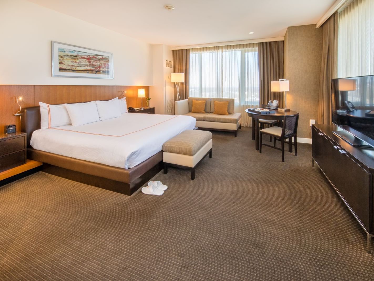 a large bed and couch in a hotel room