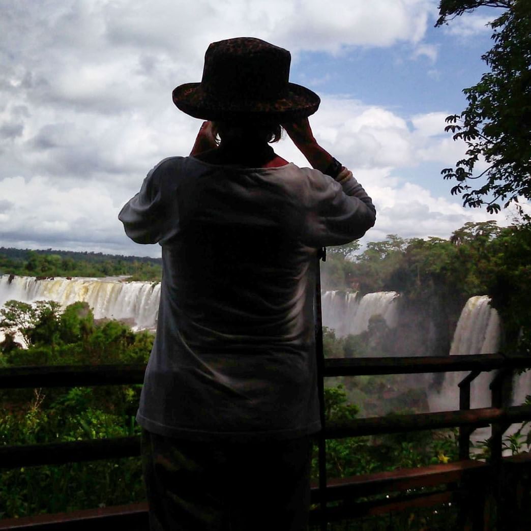 A lady looking at a waterfall near La Cantera Lodge de Selva