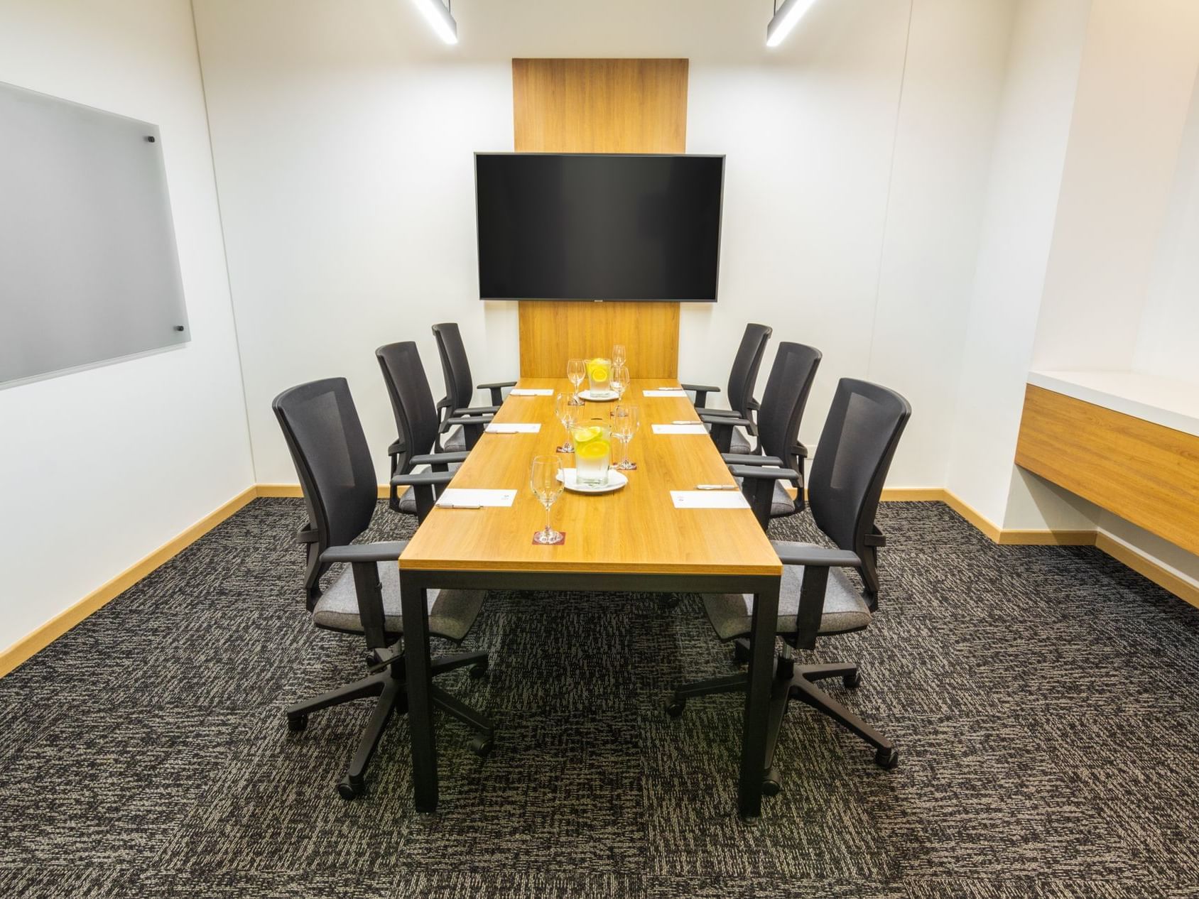 The arranged Nebraska meeting room with black chairs and a table