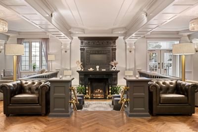 Elegant lobby area with a fireplace at The Madison Hotel