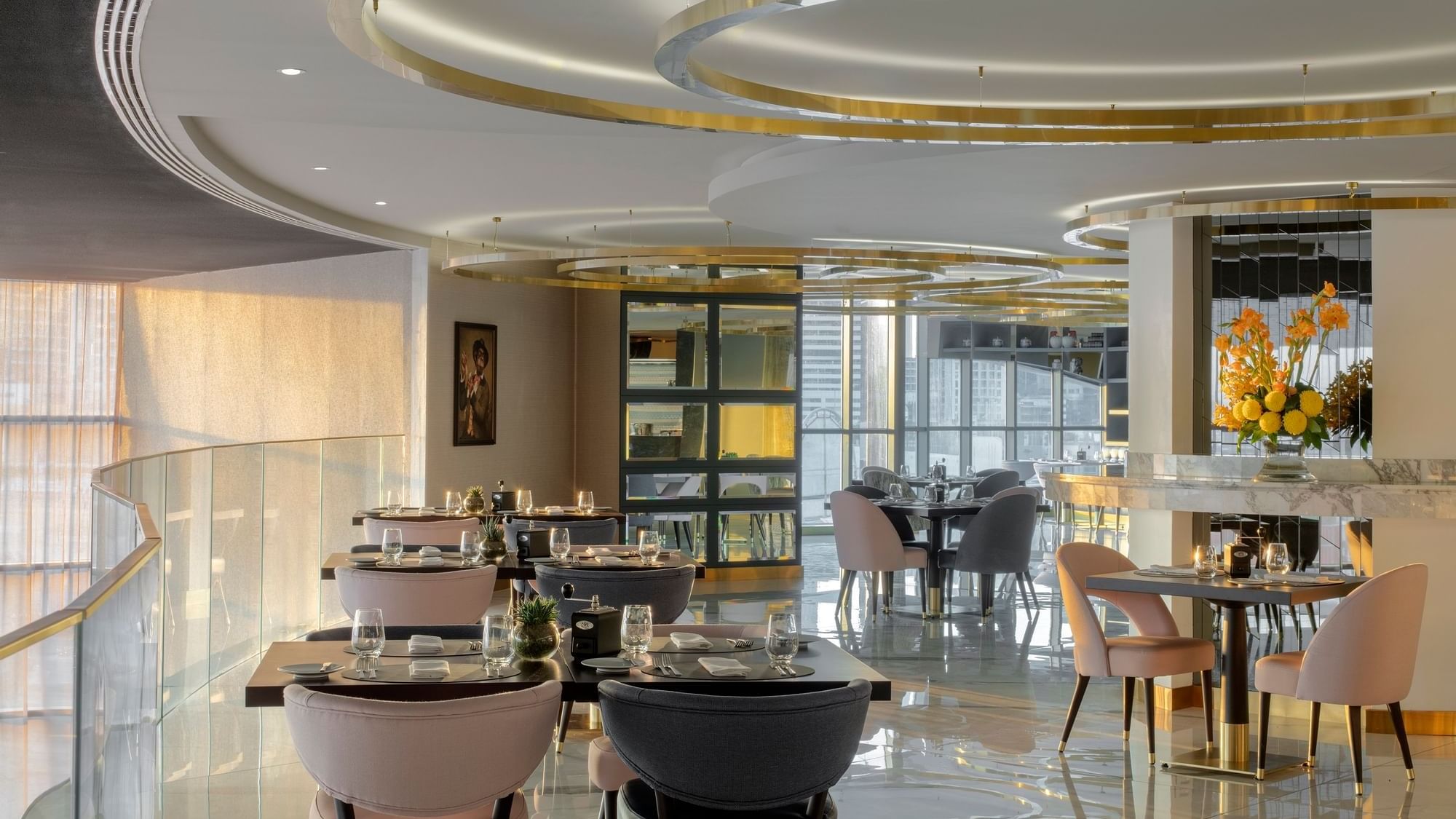 Dining tables arranged in The Stage restaurant at Paramount Hotel Dubai