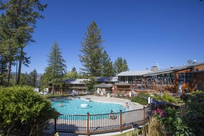 Pool area with the exterior of Fairmont Hot Springs Resort