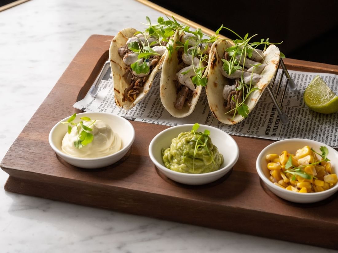 Tray with tacos served on a table in BAR THIRTY6 at Pullman Sydney Hyde Park