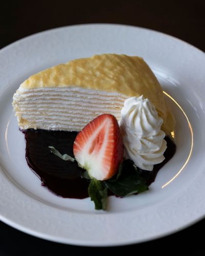 Slice of mille-feuille pastry with cream and strawberry served in the restaurant at The Ashbrook Hotel