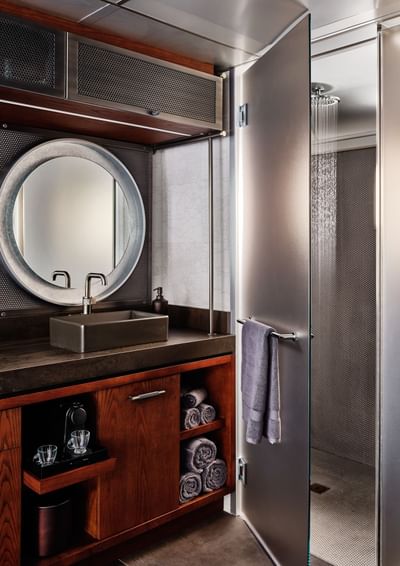 Bathroom with vanity and rainfall shower in Backstage Trailers at The Verb Hotel