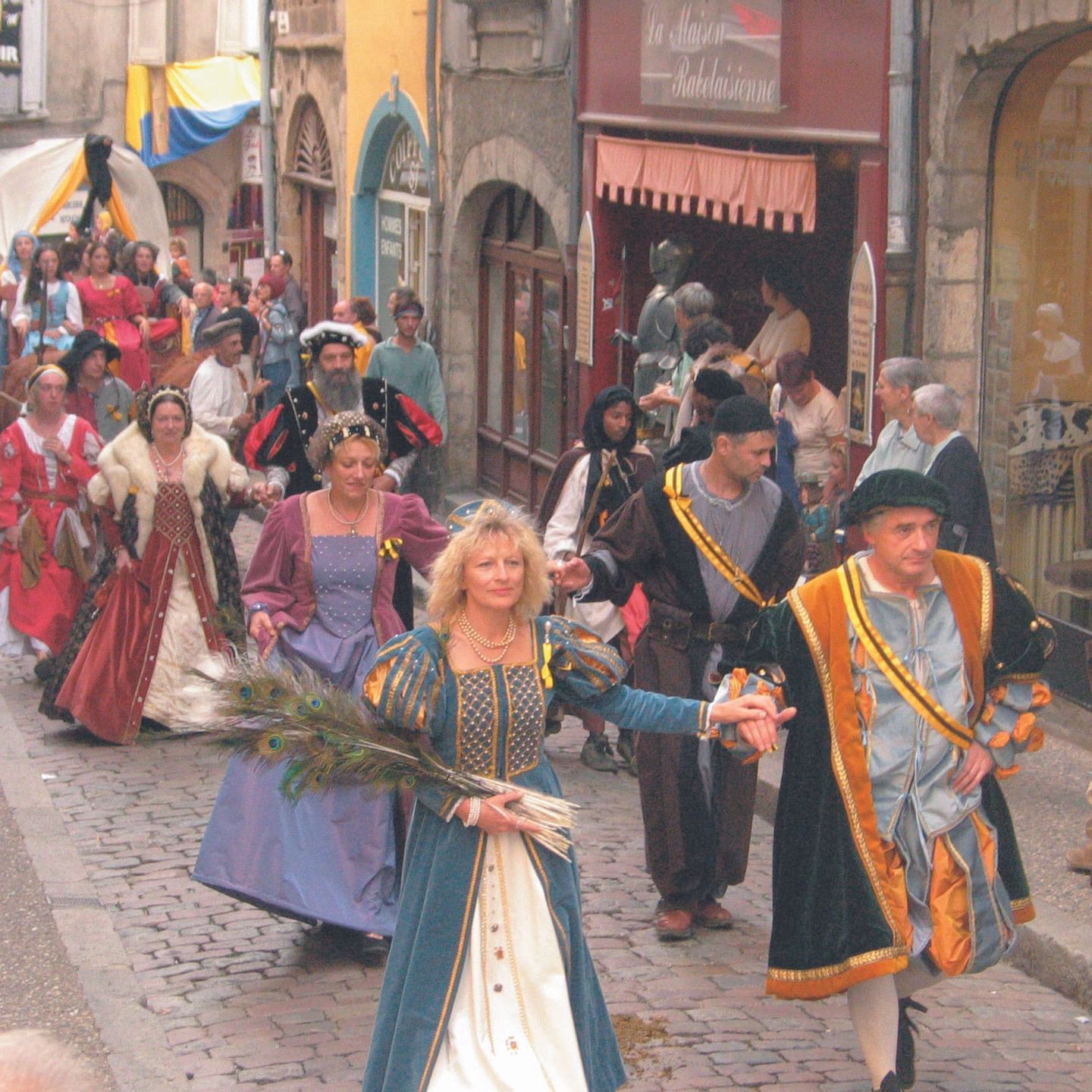 People parading at the Folklore Festival near Originals Hotels