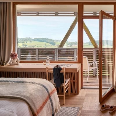 Work desk & couch by the bed in the superior Room at Falkensteiner Genuss & Wohlfühlhotel Mühlviertel