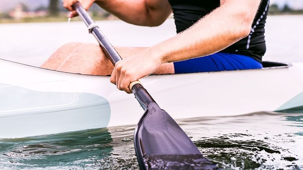 Close-up of a man paddling near Falkensteiner Hotels