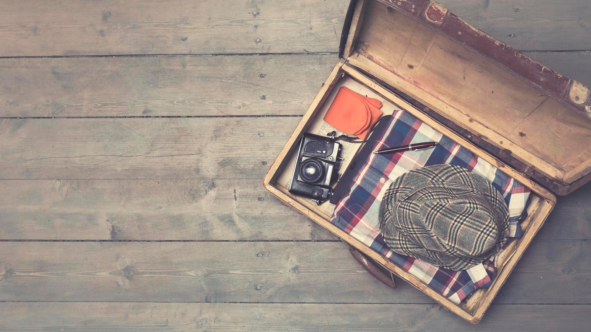 Old luggage with clothes & a camera, Falkensteiner Hotels