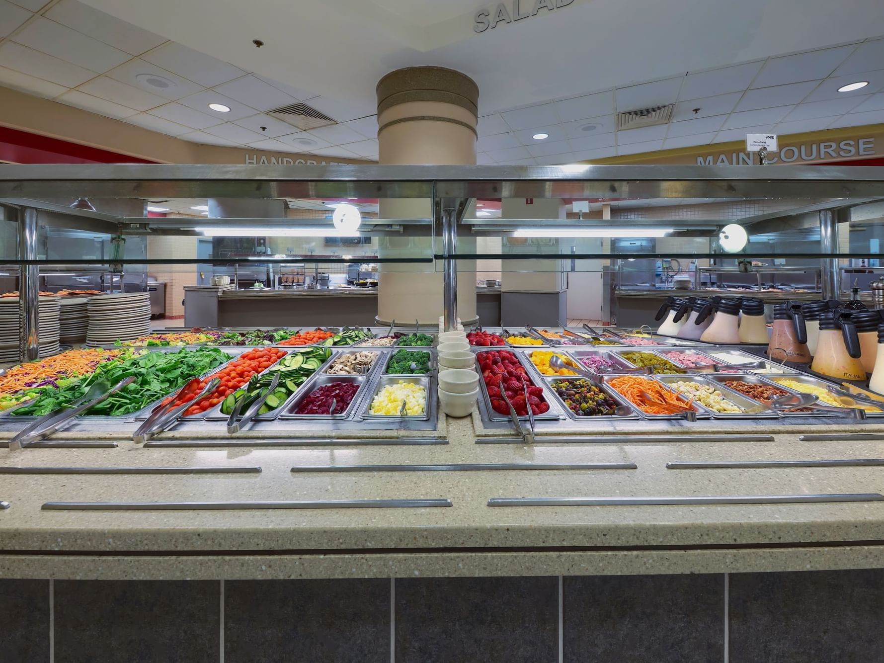 3 Squares Eatery buffet area of the NCED Hotel and Conference Center with a variety of salad options.