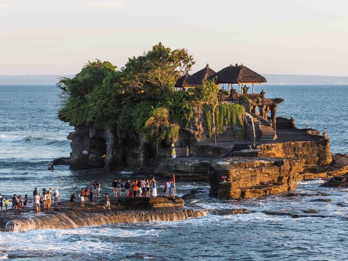 Crowd on rock at Tanah Lot Temple in Bali near Eastin Ashta Resort Canggu