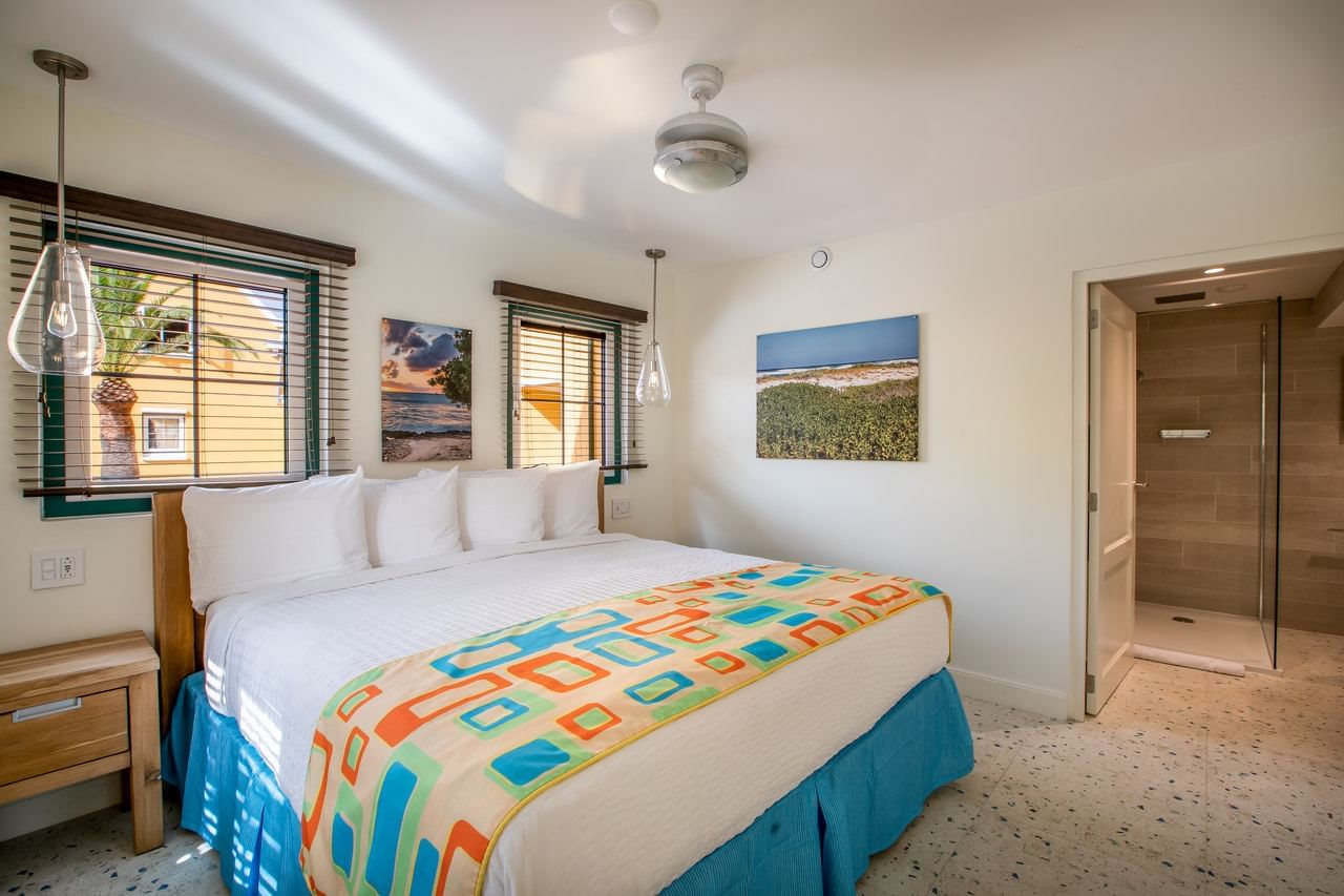 Cozy bedroom featuring a king bed with an outdoor view in Superior Studio at Amsterdam Manor Beach Resort