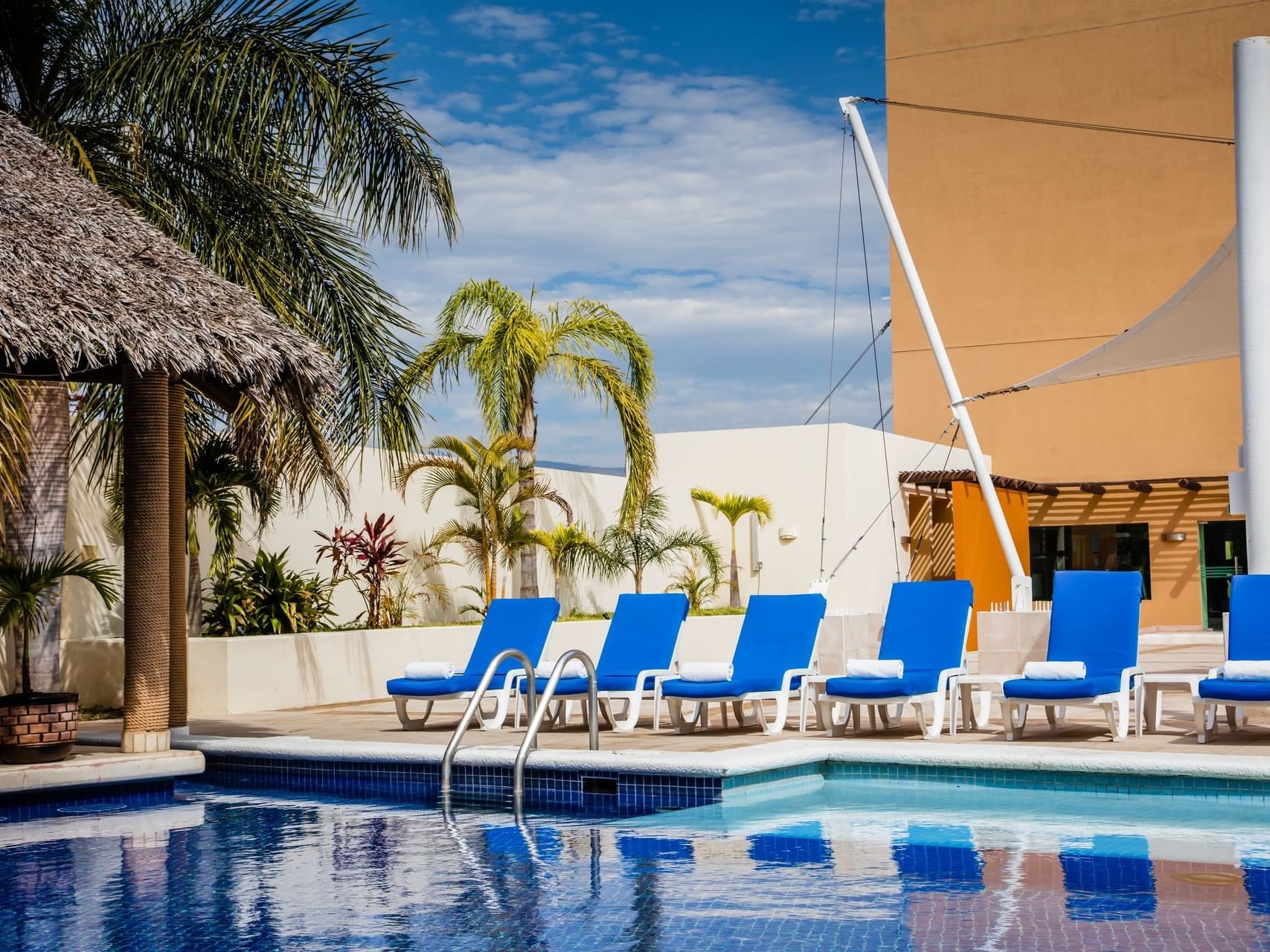 Pool beds around the swimming pool area at Fiesta Inn Hotels