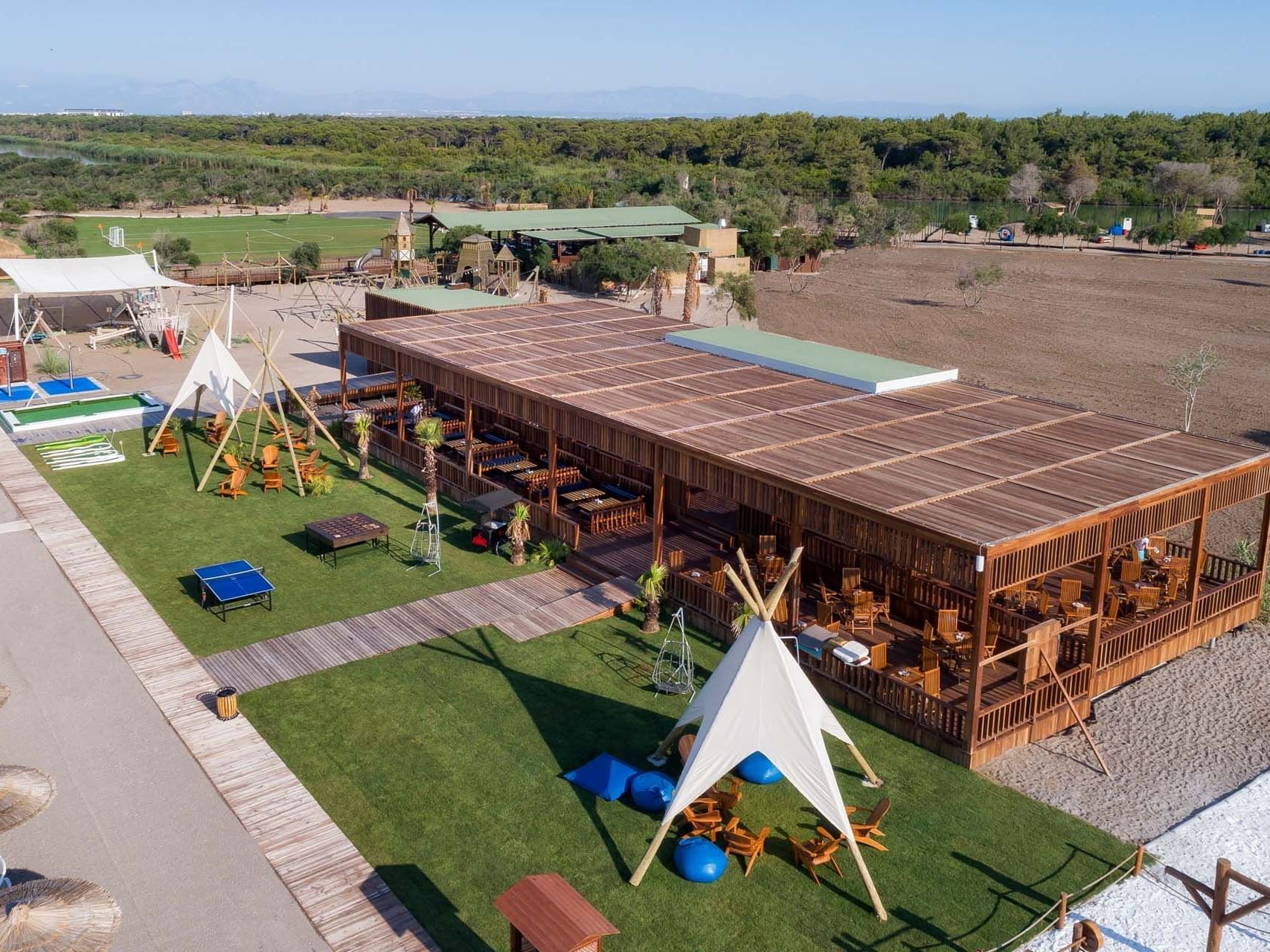 Aerial view of a modern outdoor leisure area with tents in a bar at Titanic Deluxe Golf Belek