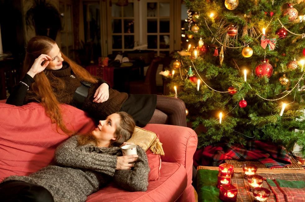 What is Twixmas featuring people relaxing near a Christmas Tree