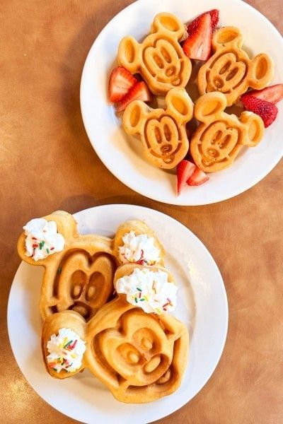 Two plates of big and small Mickey waffles at Rosen Inn Lake Buena Vista's breakfast buffet.