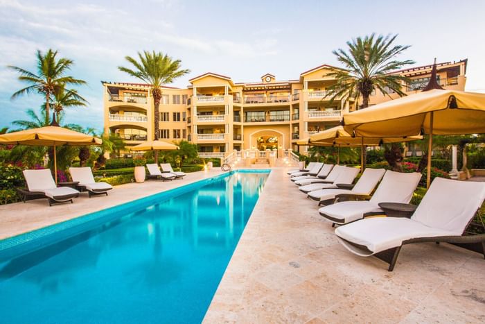 Pool with sunbeds at The Somerset on Grace Bay