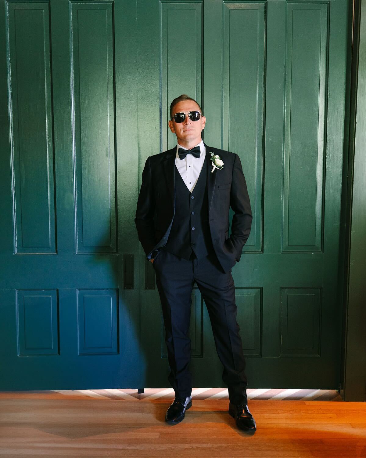 A groom posing with cofidence, waiting for his bride to be.