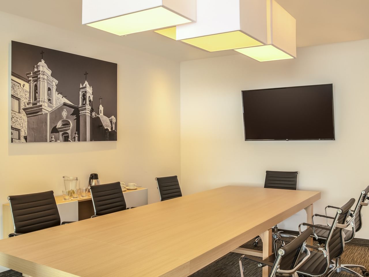 Conference table &Tv in a meeting room at Fiesta Inn Hotels