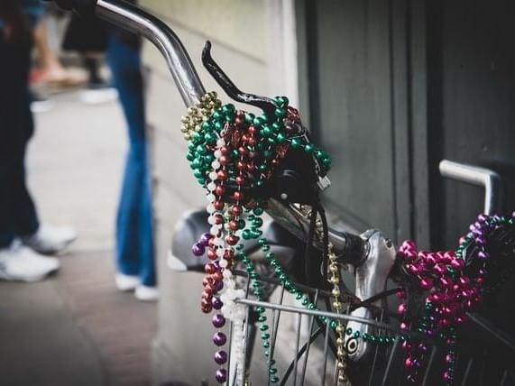 A bicycle decorated in beaded necklaces at La Galerie Hotel