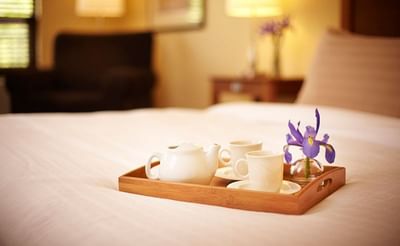 Tray with coffee served on a bed at Temple Gardens Hotel & Spa