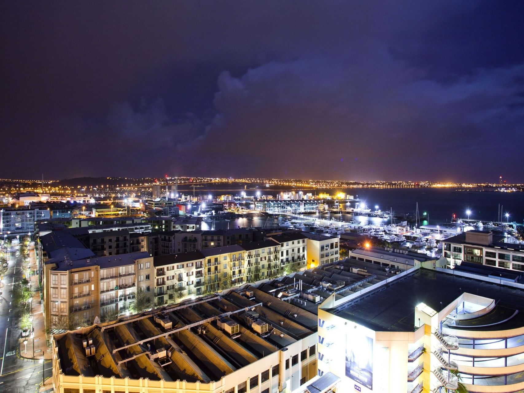 Aerial view of the Hotel & city at night near Hotel Grand Chancellor