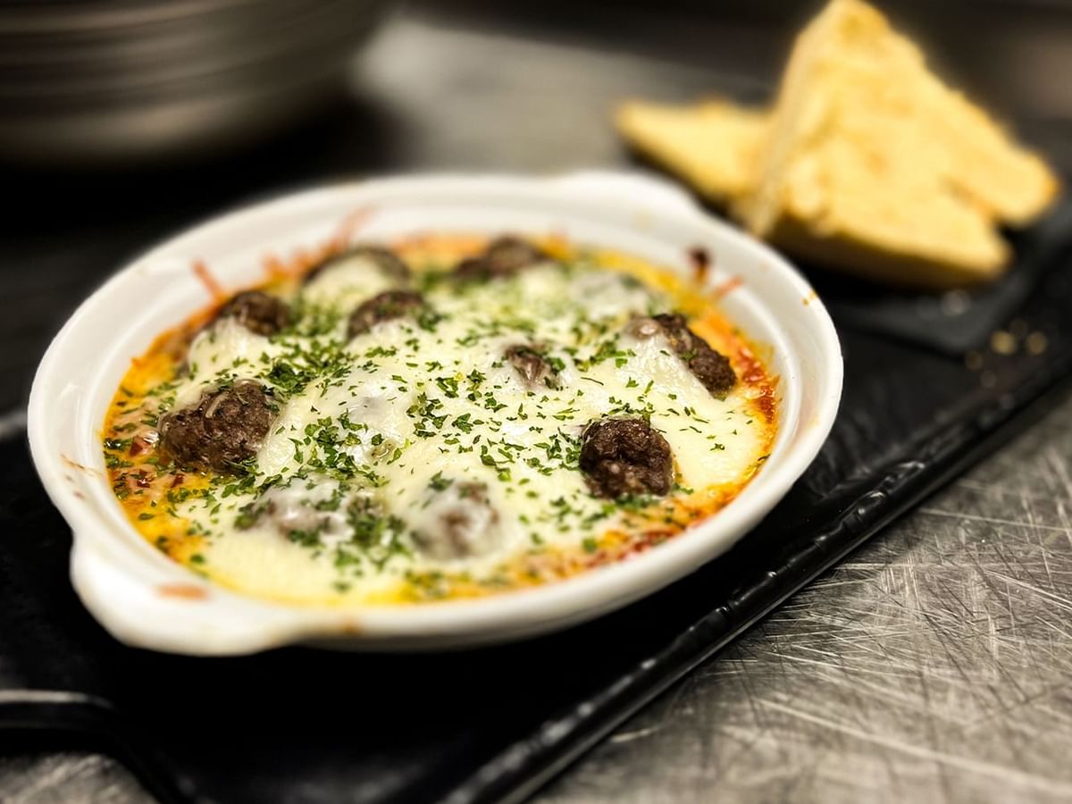 Close-up of a plate of food served in Midnight Sun Lounge at Midnight Sun, a Coast Hotel