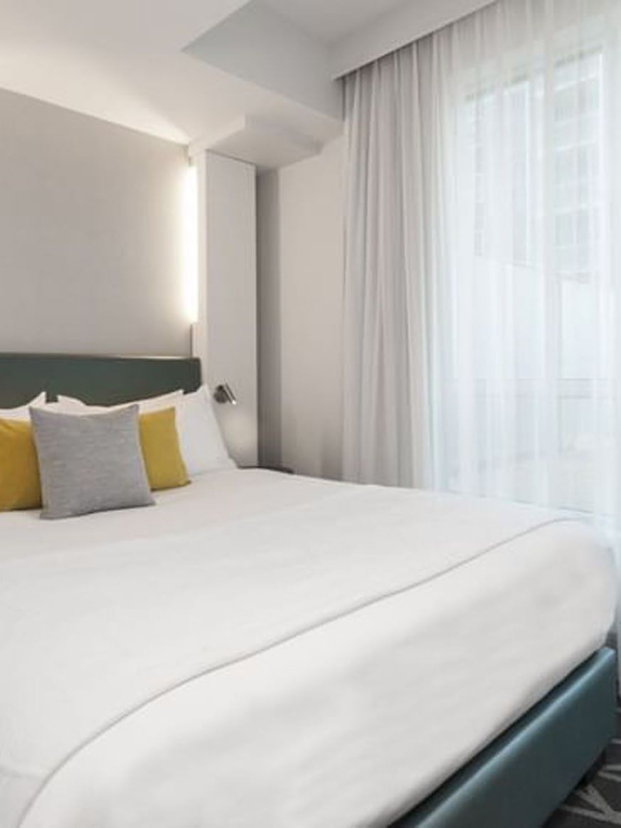 Elegantly designed Penthouse Drummond room at Warwick Le Crystal Montreal.