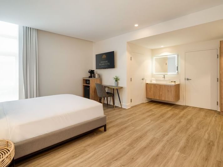 Accessible Bedroom Queen showing the king bed, desk area, and floating wood vanity at Kenmore Village Hotel South Beach