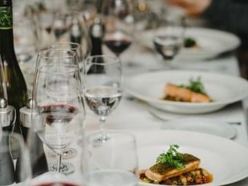 Wine, water & salmon dishes served at Nita Lake Lodge