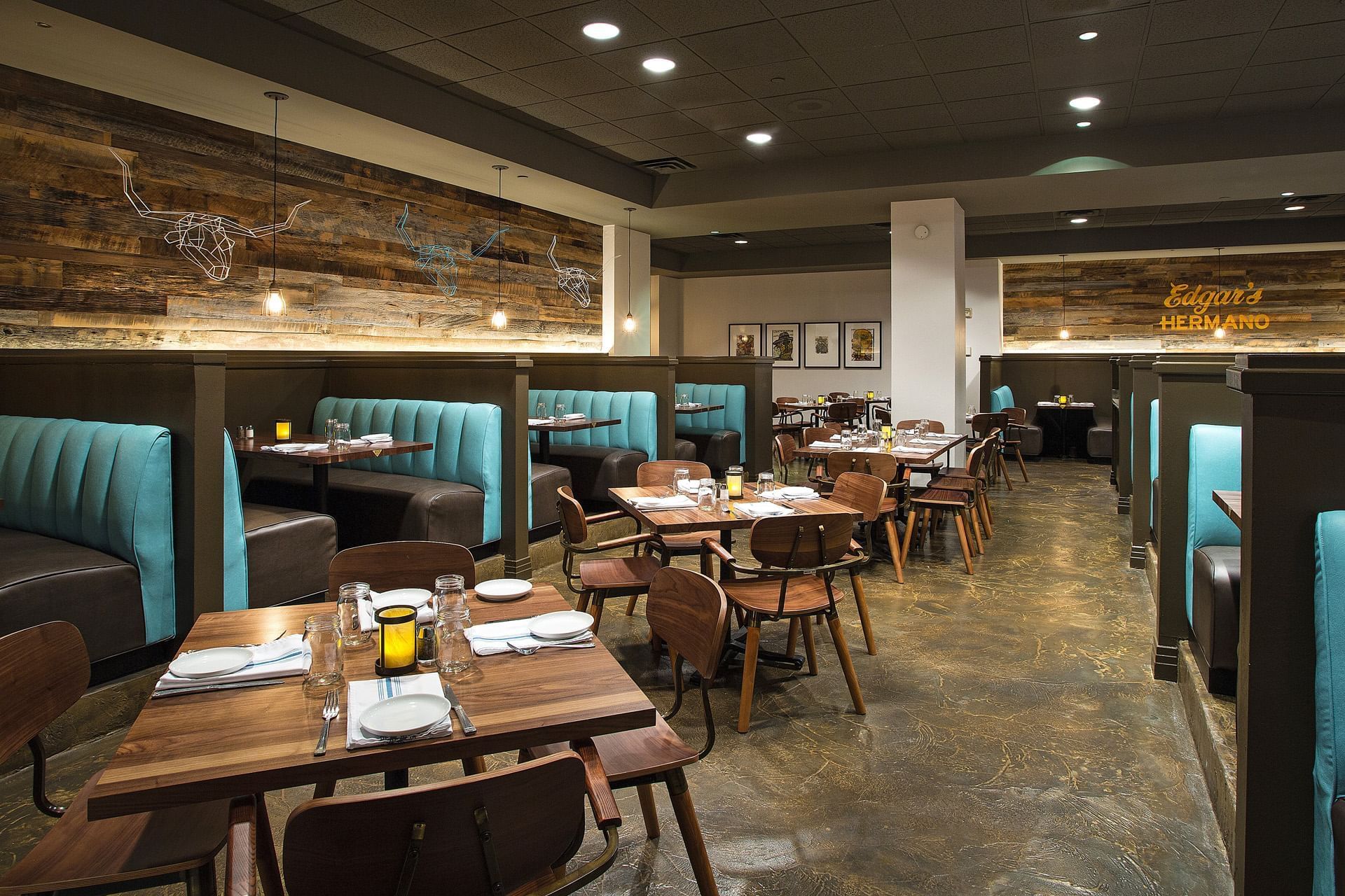 a restaurant dining area with booths and tables