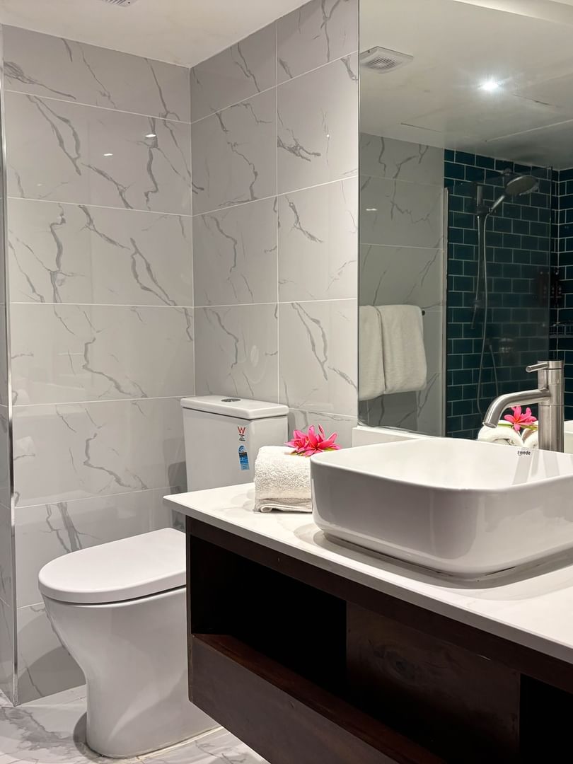 Bathroom with modern fixtures and decor at Warwick Fiji in Korolevu.