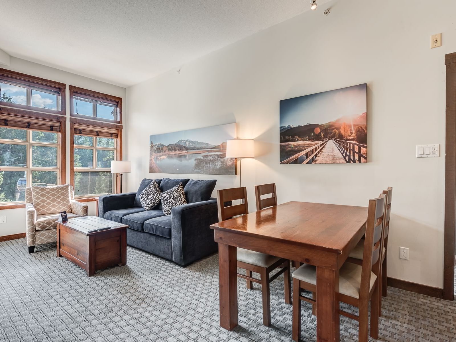 Dining table by living area in 2 Bedroom Slopeside at Blackcomb Springs Suites