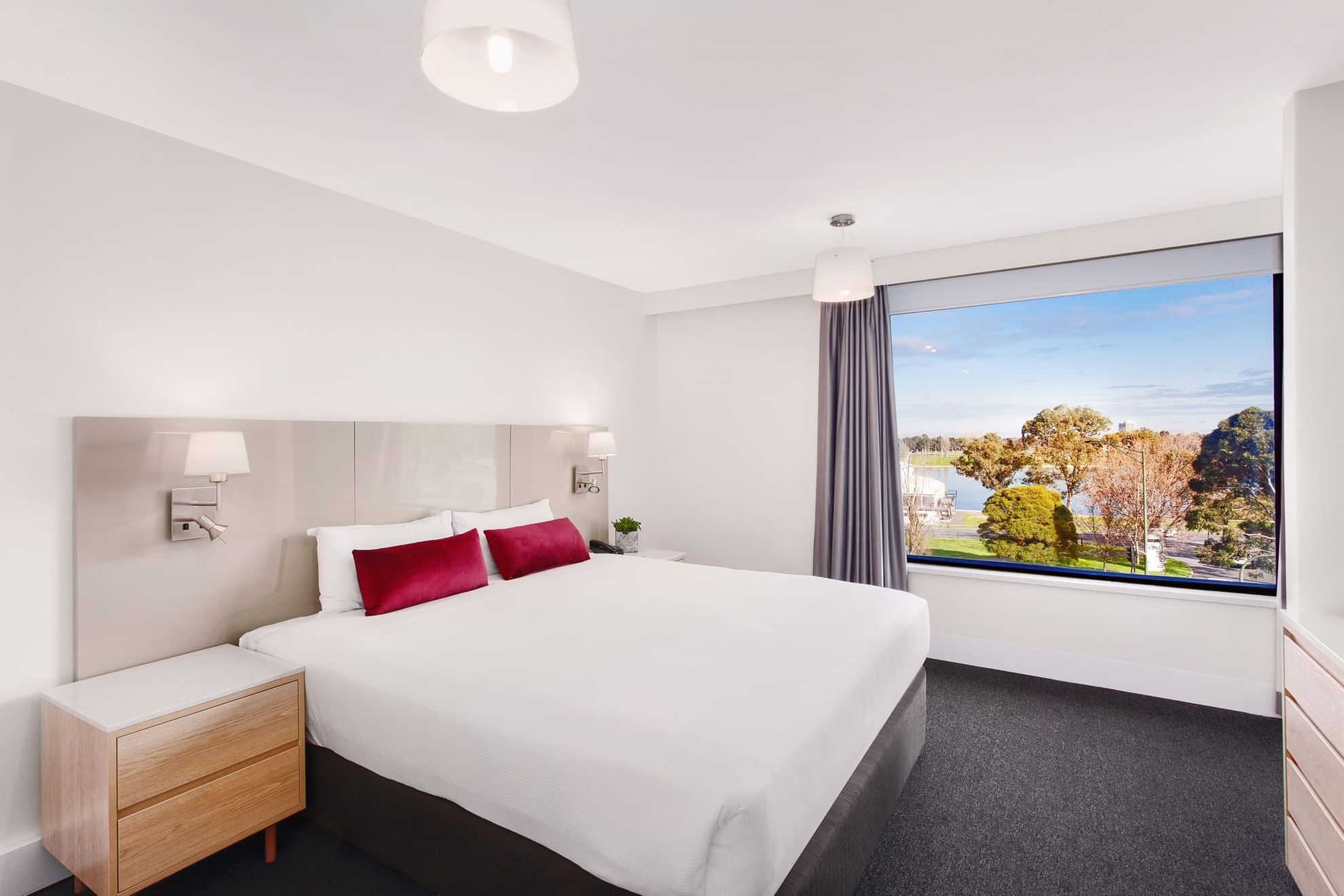 King bed by side desk in Mercure Superior One-Bedroom Lakeview Suite at Pullman Albert Park