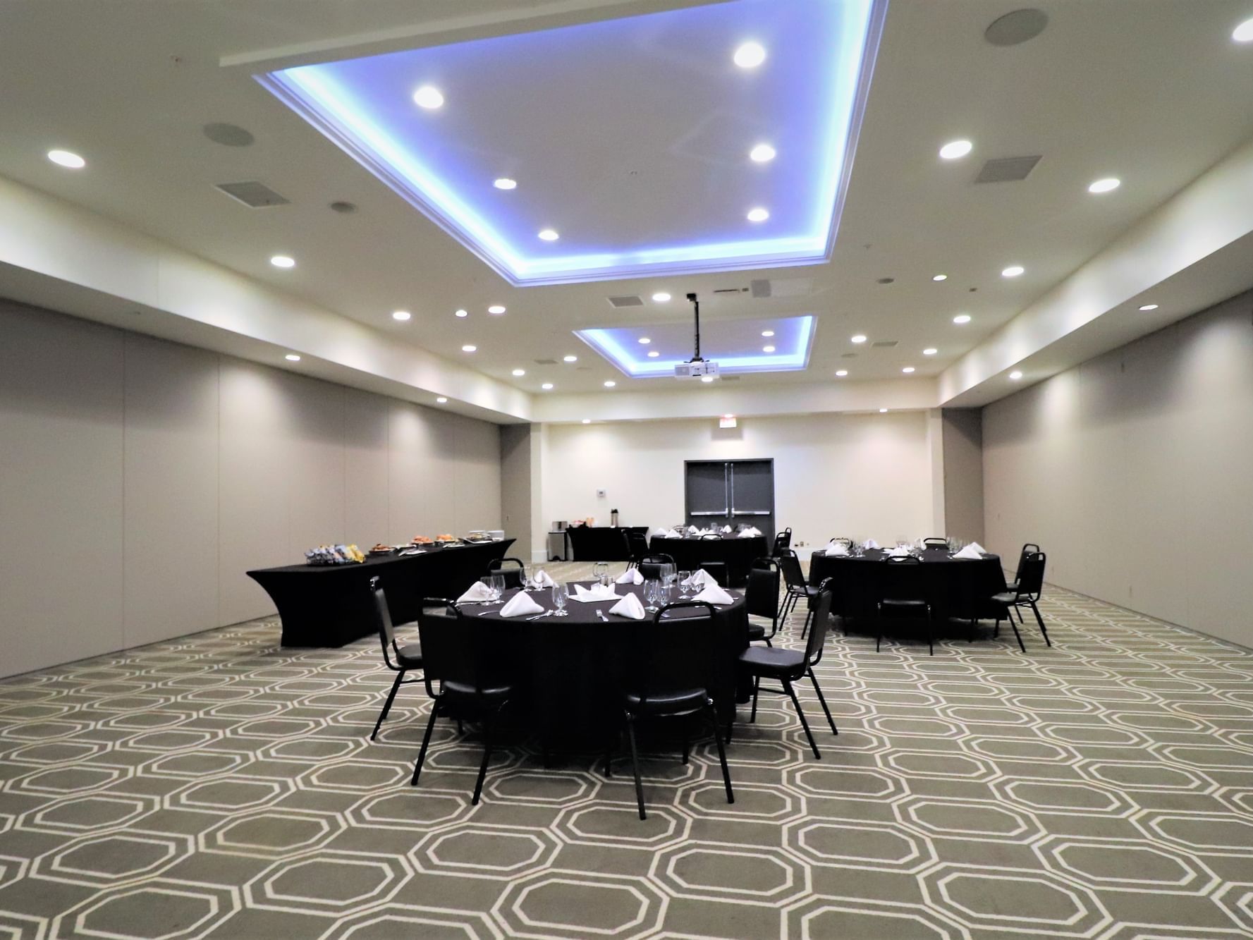 Banquet round tables arranged in Aspire at Harborside Hotel
