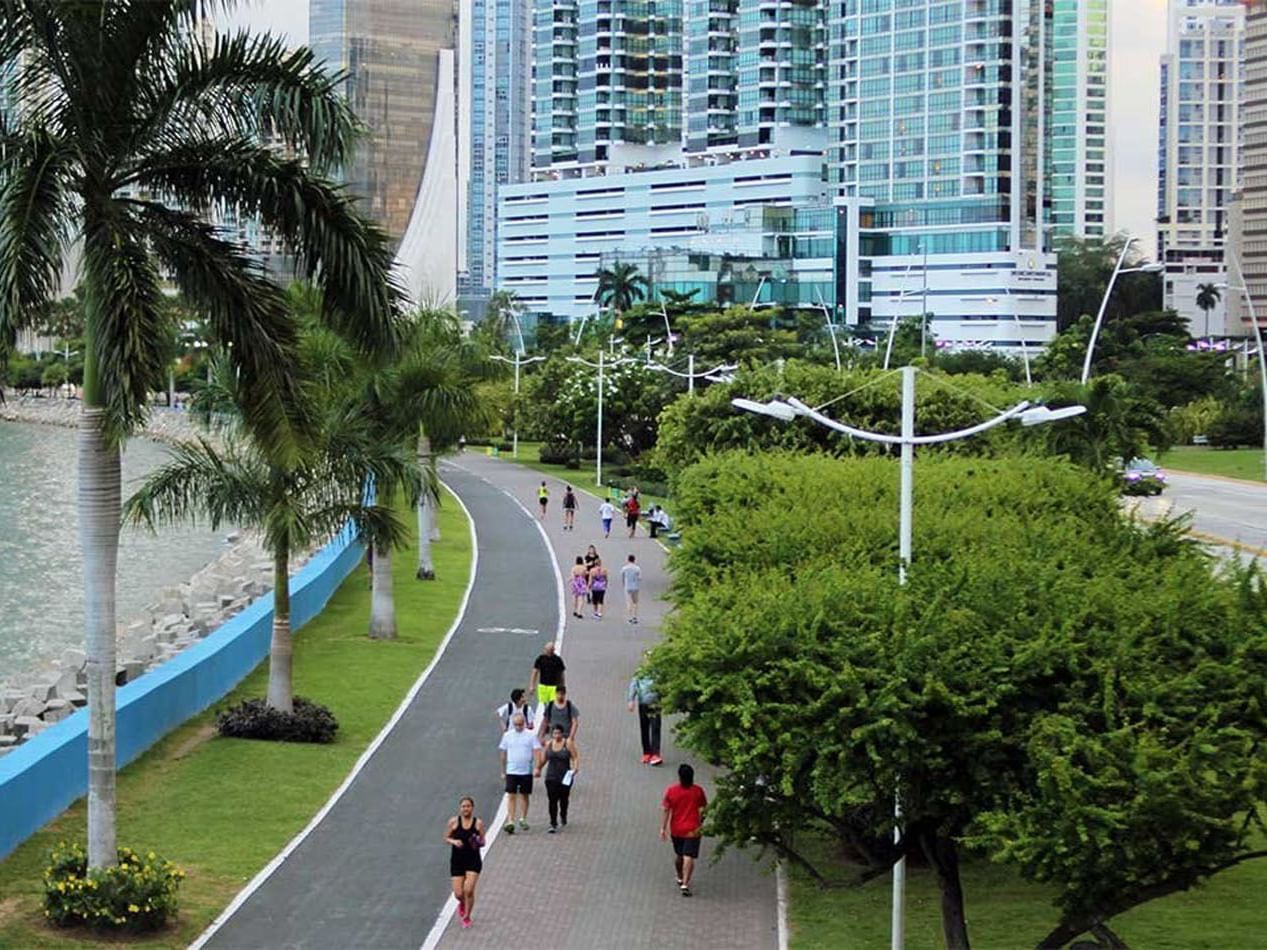 People walking in Coastal Strip by the lake near Megapolis Hotel Panama