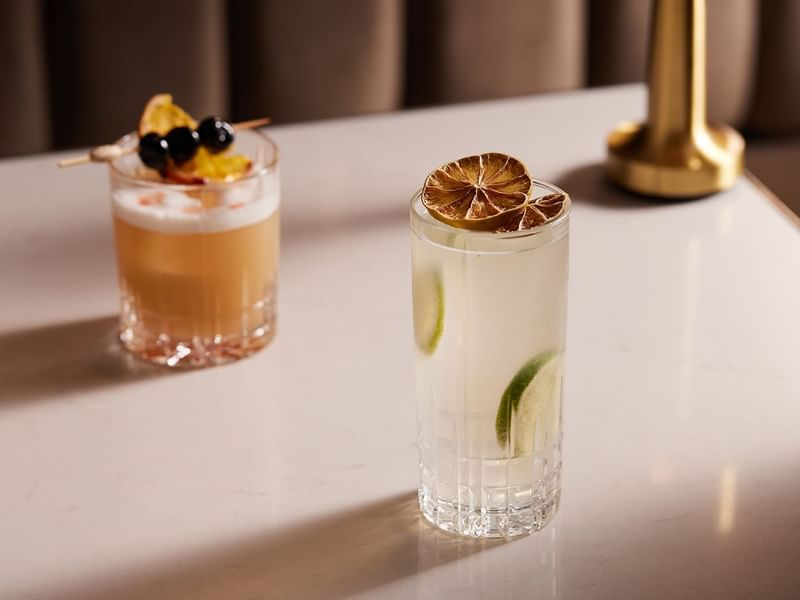 Two cocktails served on a marble counter in TWR Bar at Crown Hotel Melbourne