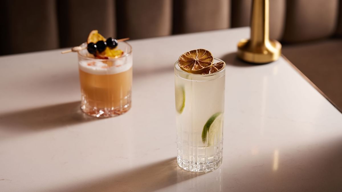 Two cocktails served on a marble counter in TWR Bar at Crown Hotel Melbourne