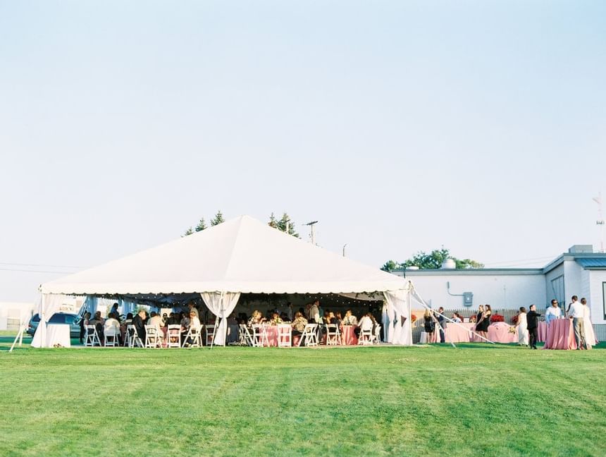 Outdoor event with guests at Evergreen Resort