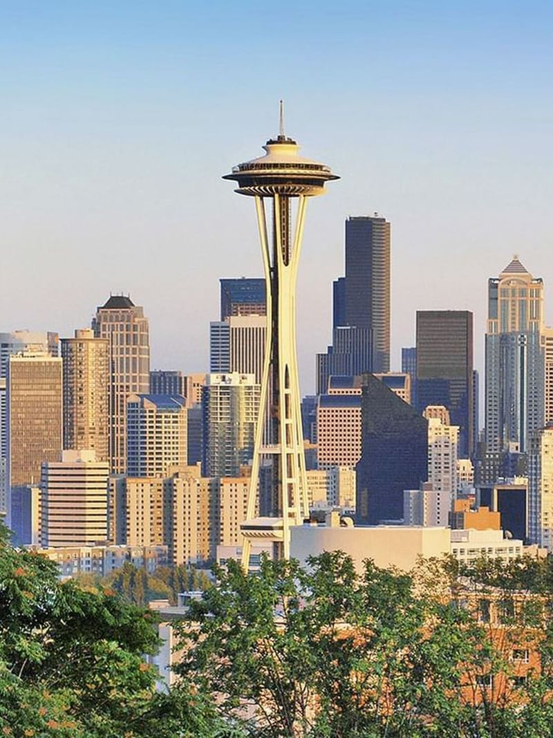 City skyline featuring the iconic Space Needle surrounded by skyscrapers near Warwick Seattle