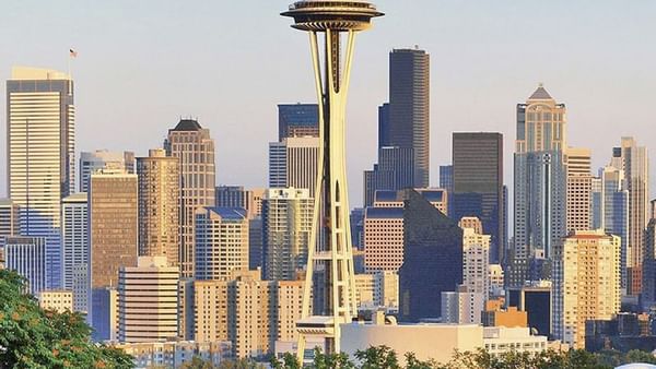 City skyline featuring the iconic Space Needle surrounded by skyscrapers near Warwick Seattle