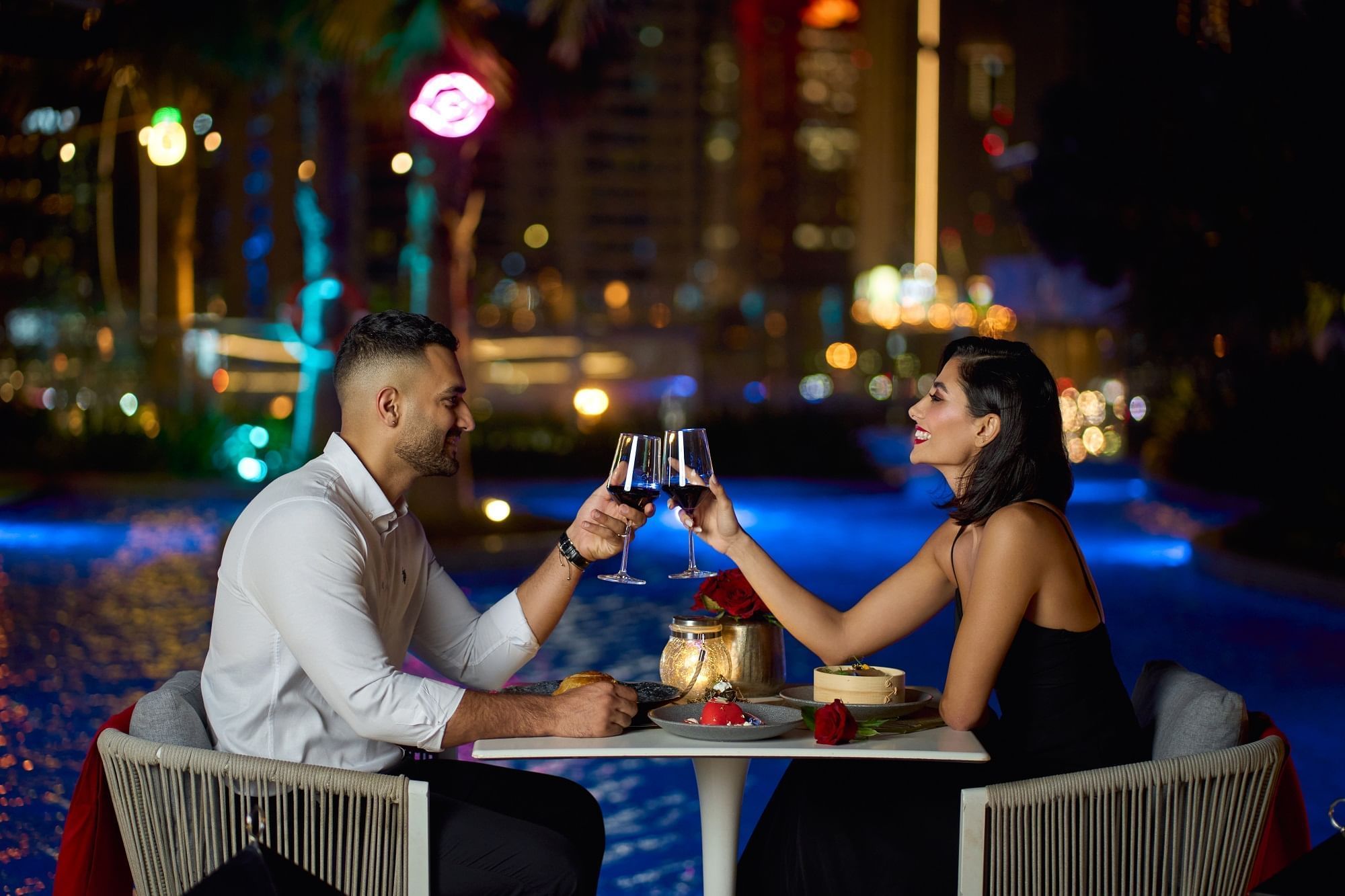 Couple toasting their wine glasses at Paramount Hotel Dubai