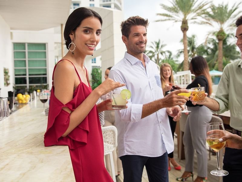 Couple enjoying drinks at Diplomat Beach Resort The Hotel Bar