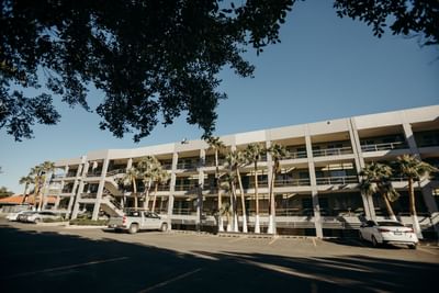 Exterior view of the hotel & car park at Araiza Hotel Calafia