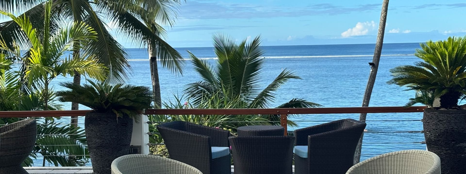 Outdoor seating area with ocean view at Sunset Terrace Bar, Warwick Fiji Resort and Spa, Korolevu