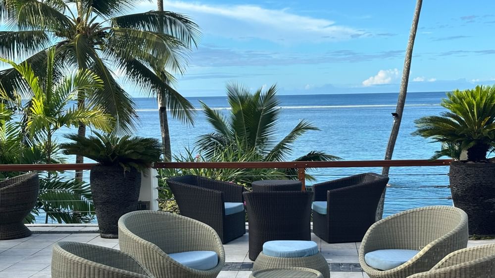 Outdoor seating area with ocean view at Sunset Terrace Bar, Warwick Fiji Resort and Spa, Korolevu.