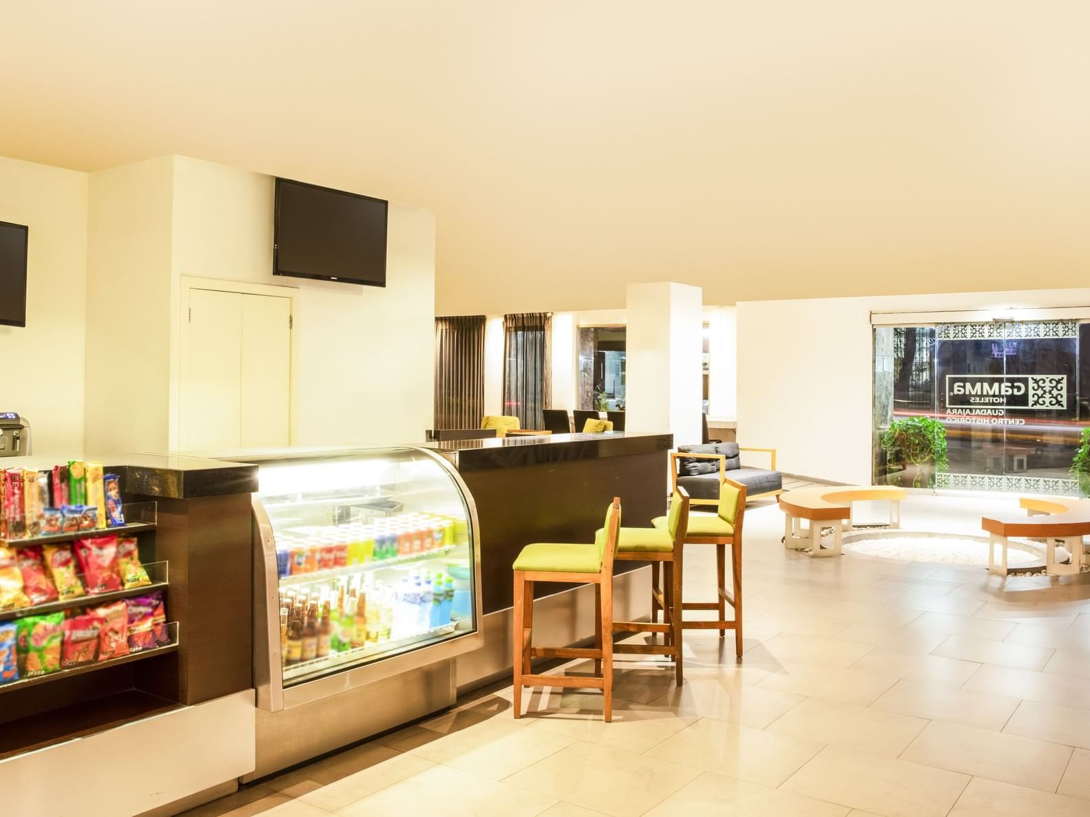 Counter with snacks & lounge area in a Café at Gamma Hotels